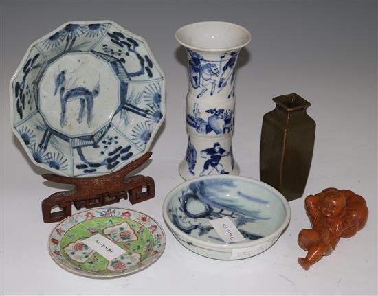 Two Chinese vases, three dishes, a hardwood figure and a stand